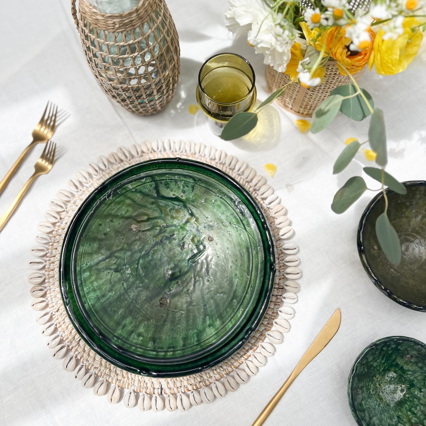 rustic ceramic handmade bowl in varying shapes and sizes with green glaze
