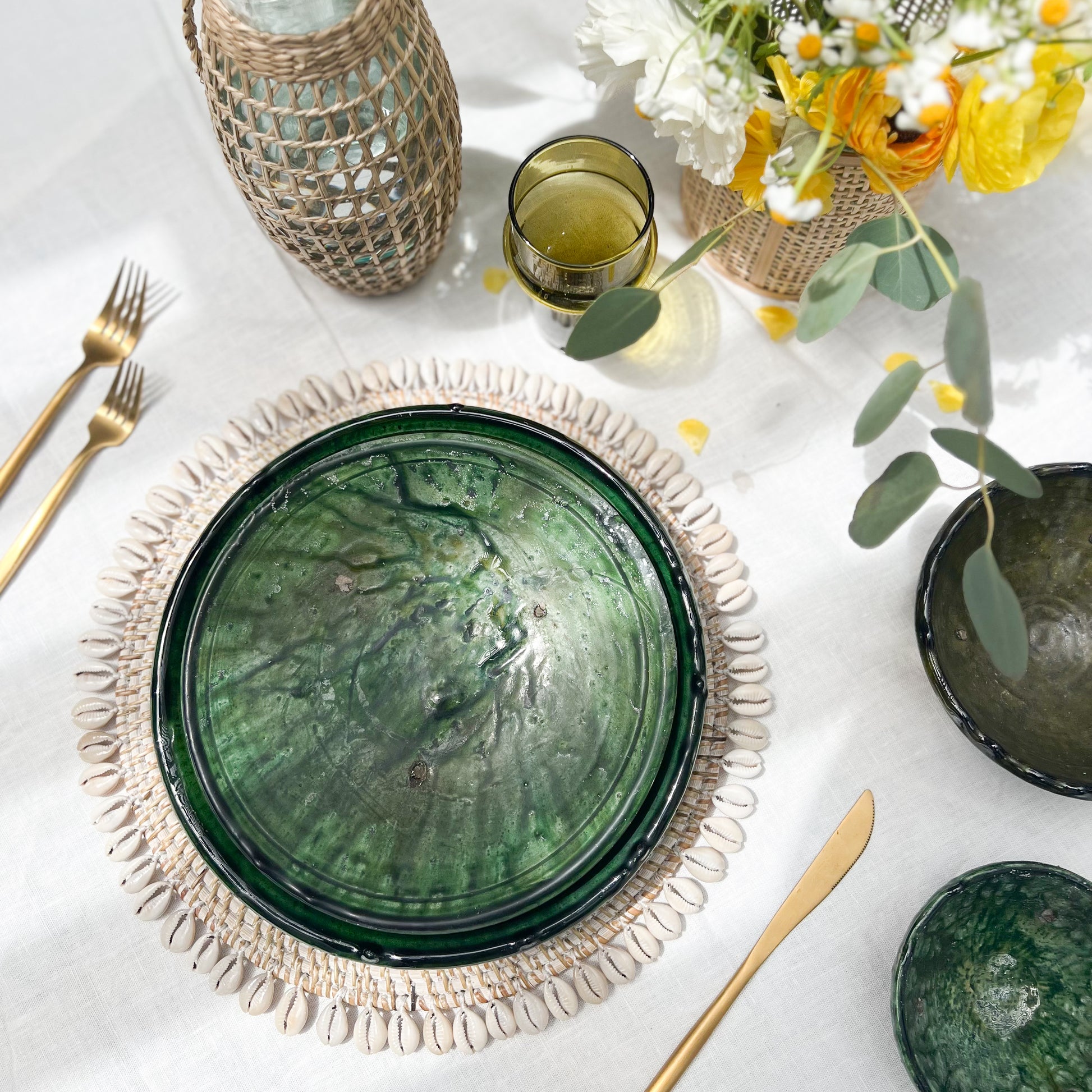 rustic ceramic handmade bowl in varying shapes and sizes with green glaze