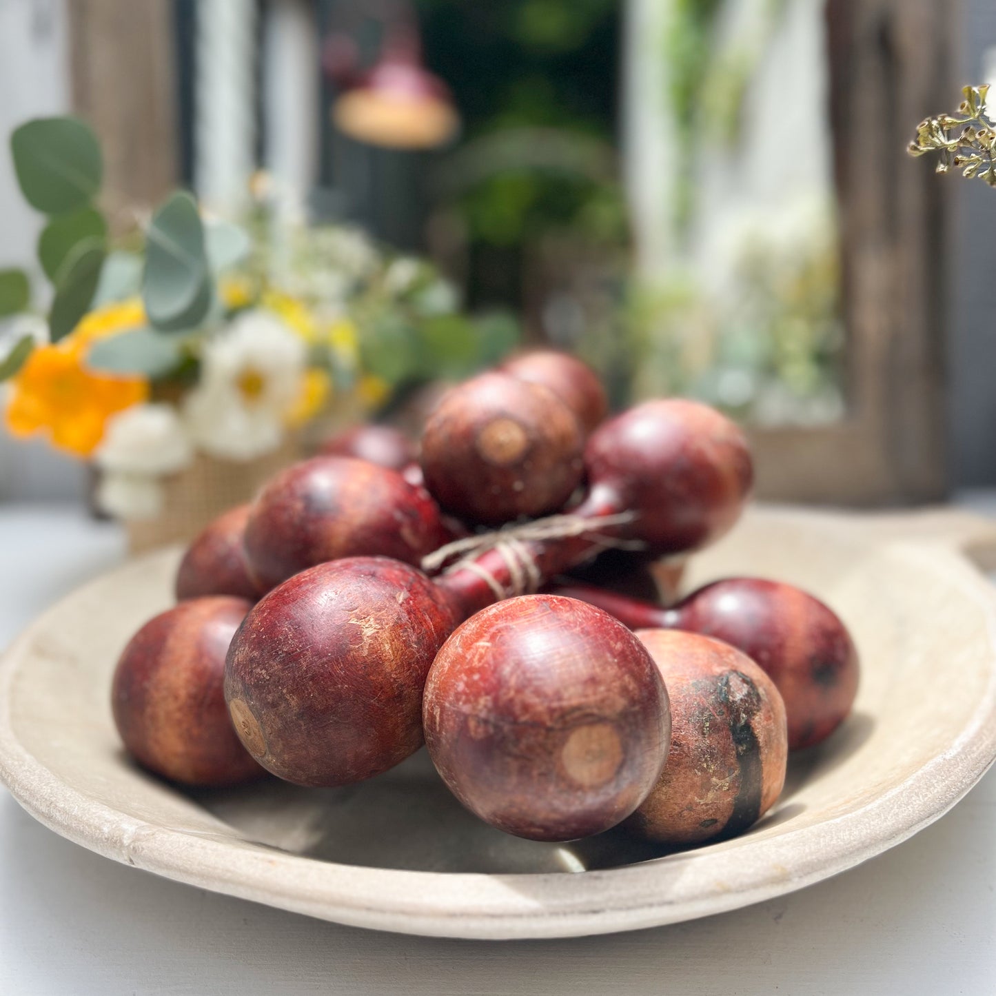 vintage wooden hand held dumbbells in cherrywood color with some aging.