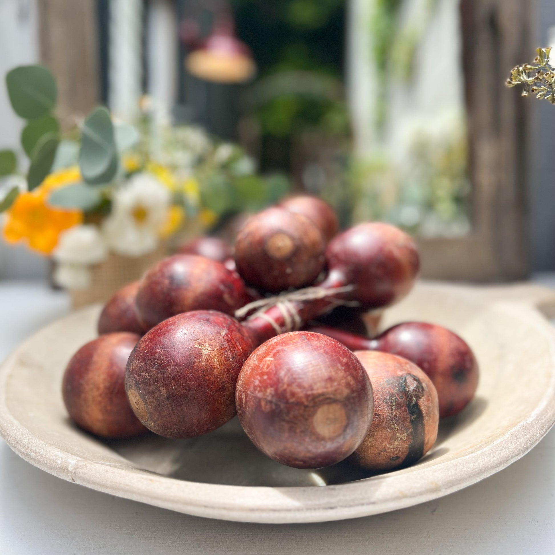 vintage wooden hand held dumbbells in cherrywood color with some aging.