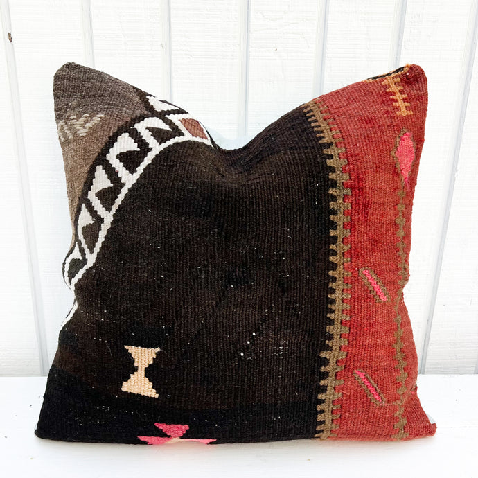 salmon red, brown and black colored Turkish rug pillow