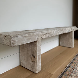 Rustic wood bench with thick slabs of distressed wood