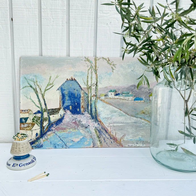 Mostly pastel colored French countryside scene with cobalt blue building