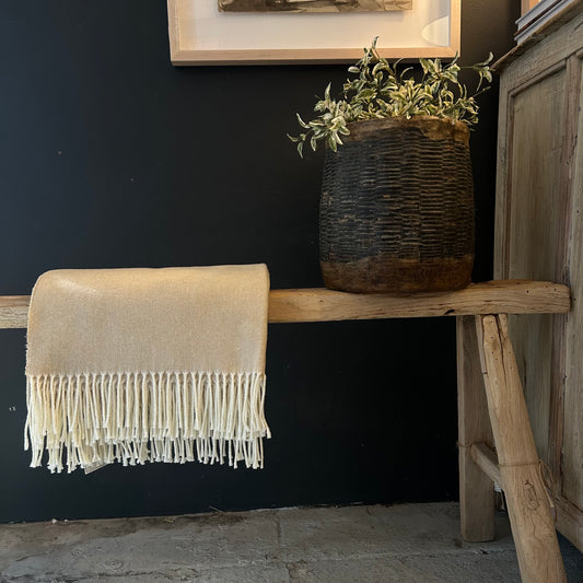 sand colored throw with cream colored fringe