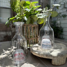 Load image into Gallery viewer, clear glass carafes with domed bottoms that have red and blue French text