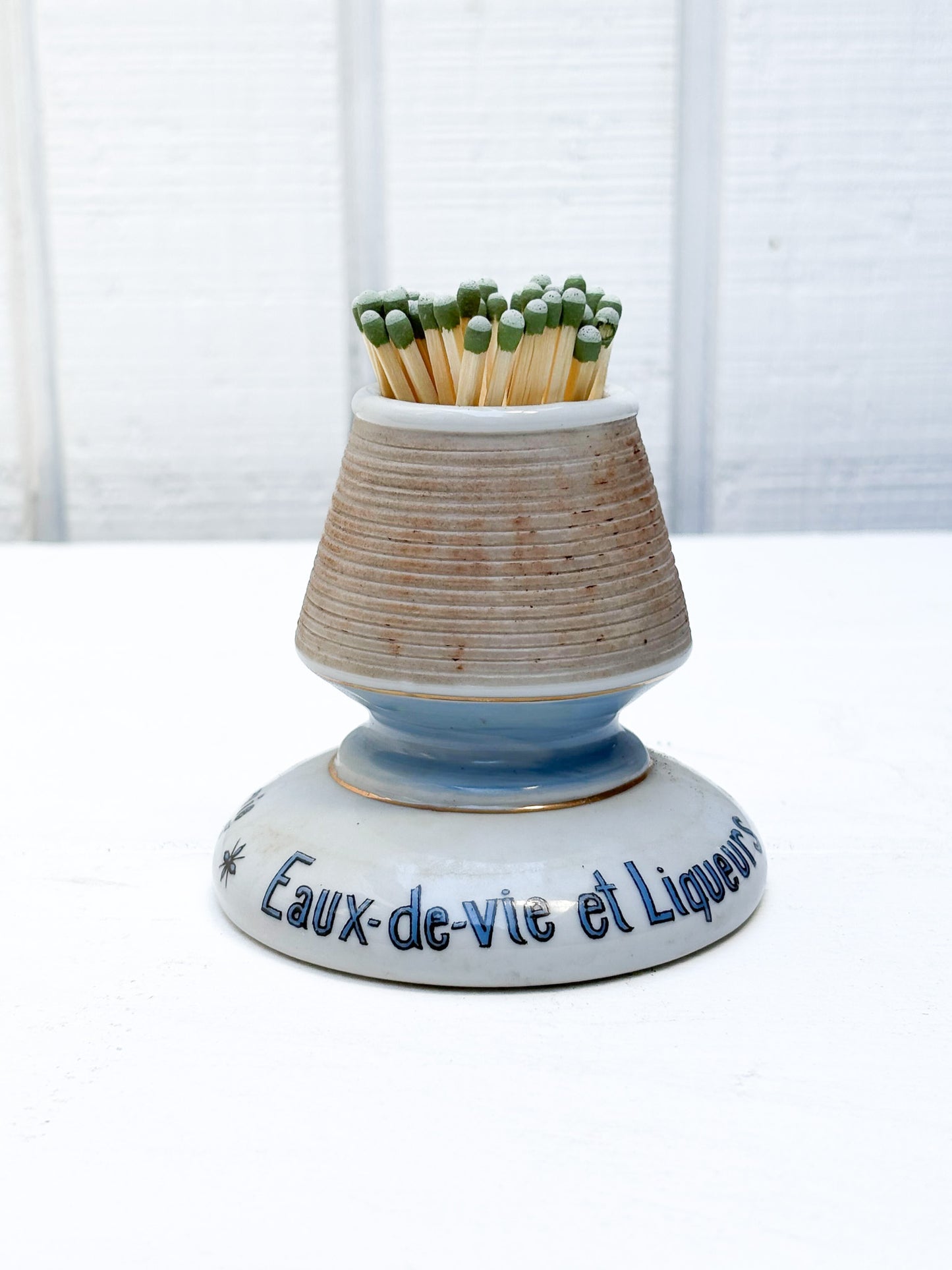 Ceramic match striker with matches on a white background