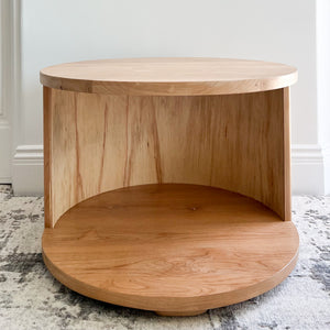 round side table with open middle and quarter round detailing on sides