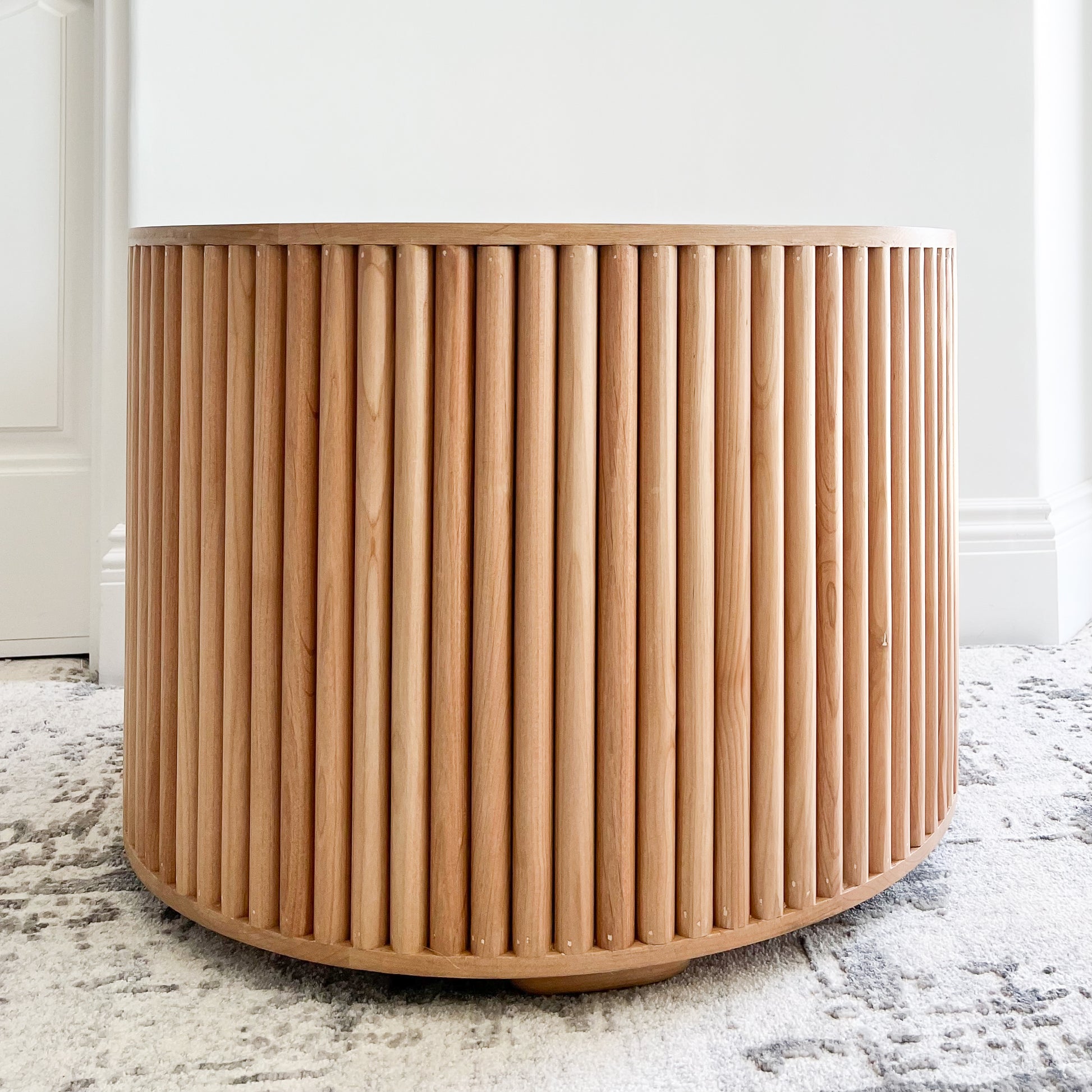 round side table with open middle and quarter round detailing on sides