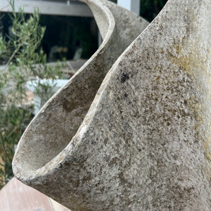 large abstract shaped concrete planter with aging 