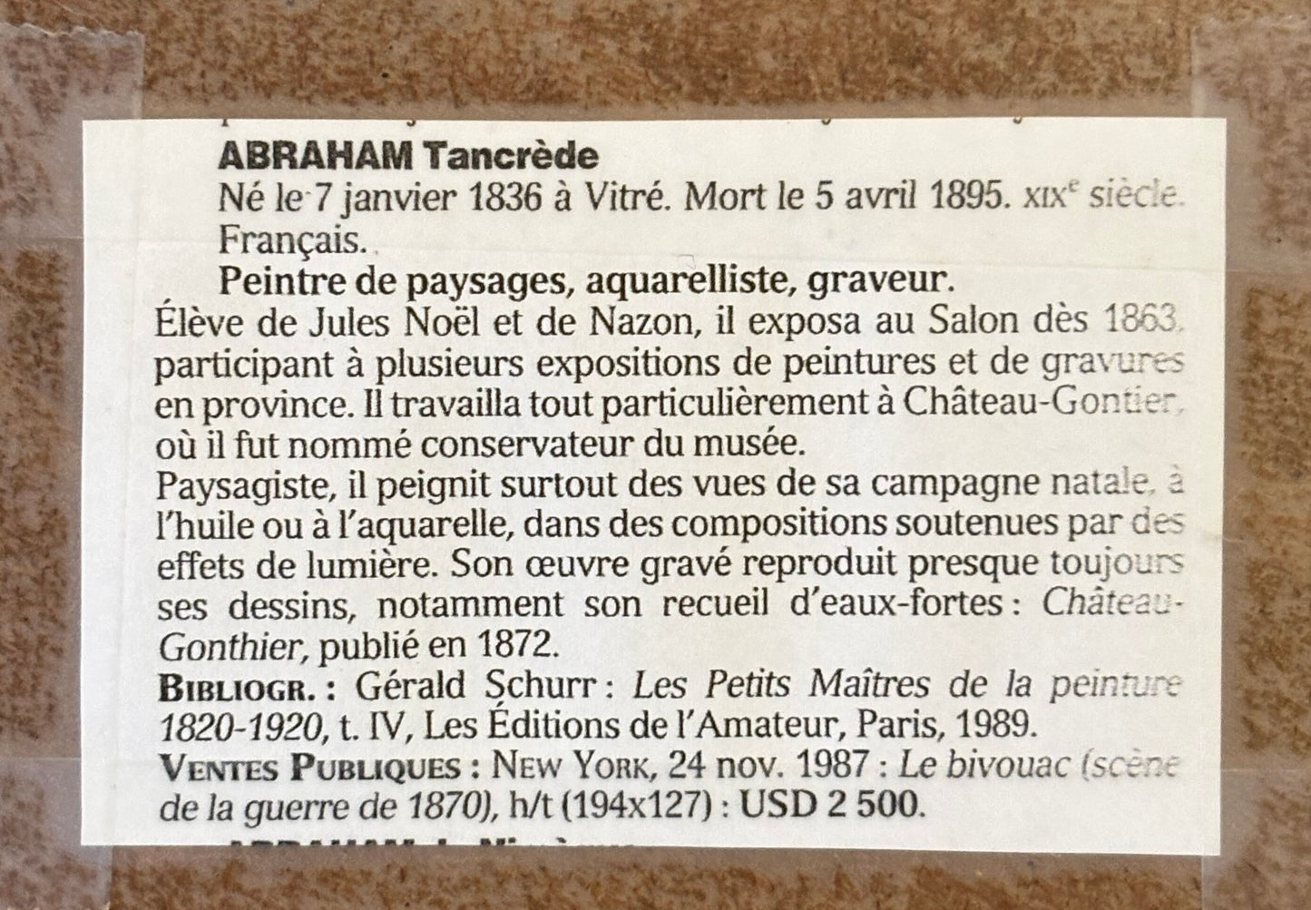 Plaque with text about Abraham Tancrède on a stone wall