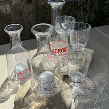 Load image into Gallery viewer, clear glass carafes with domed bottoms that have red and blue French text