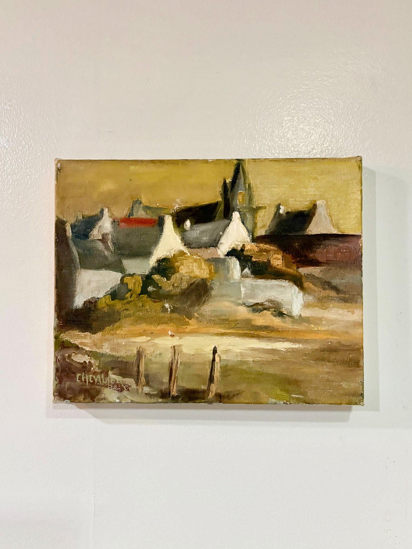 Painting of boats on a dock with a signature at the bottom right corner.
