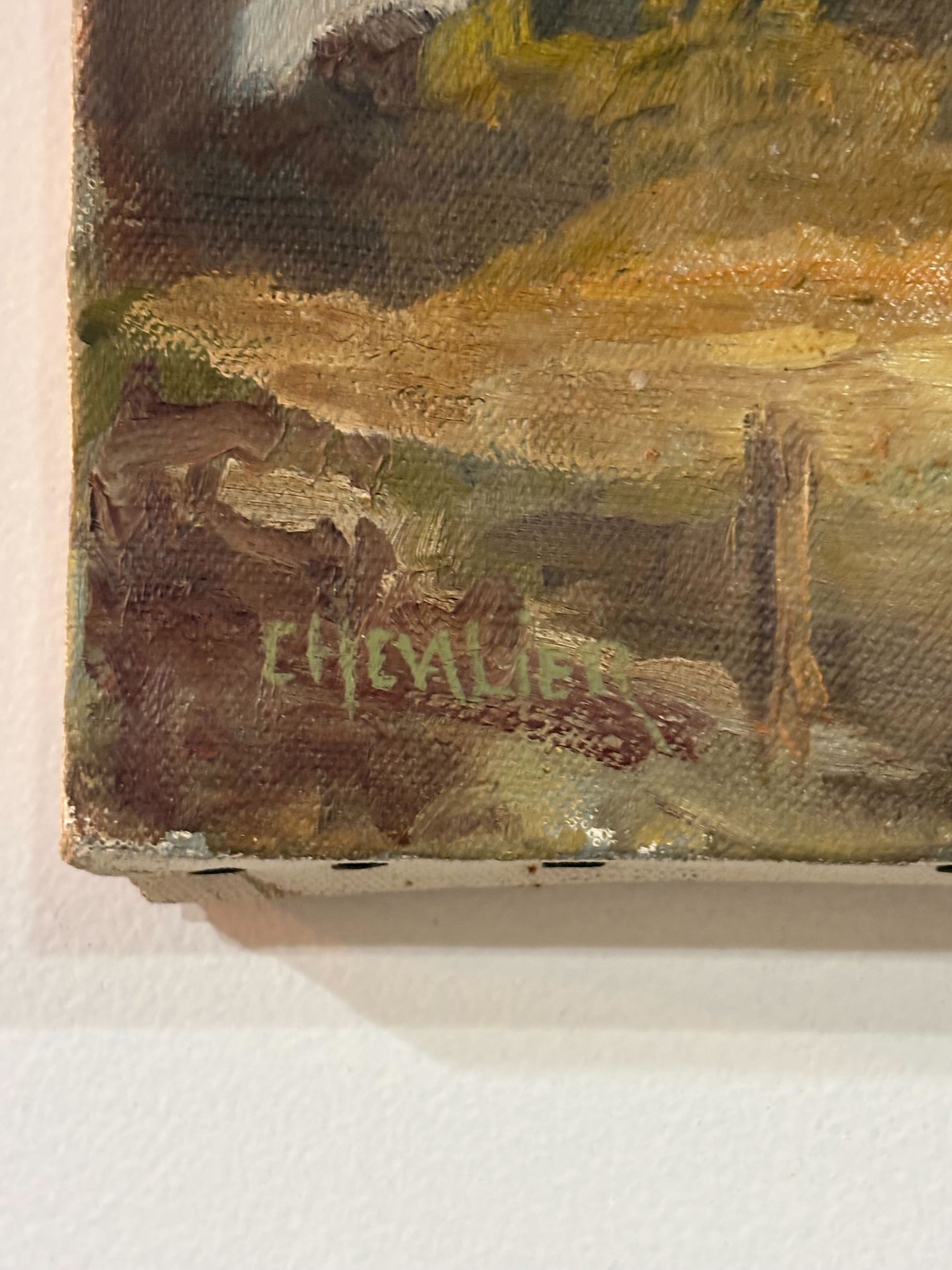 Close-up of a painting with a signature on the bottom right corner.