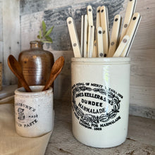 Load image into Gallery viewer, vintage off white ceramic canister with black logo and text