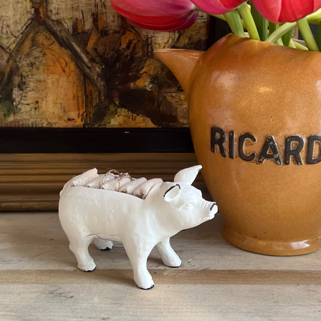 white metal pig ring holder, with burlap slots on top for rings