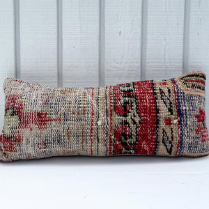 Decorative pillow with geometric pattern on a white background