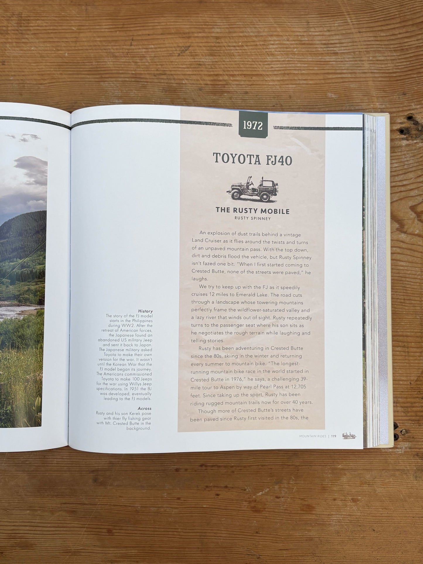 Open book on a wooden surface with text about a 1972 Toyota FJ40.
