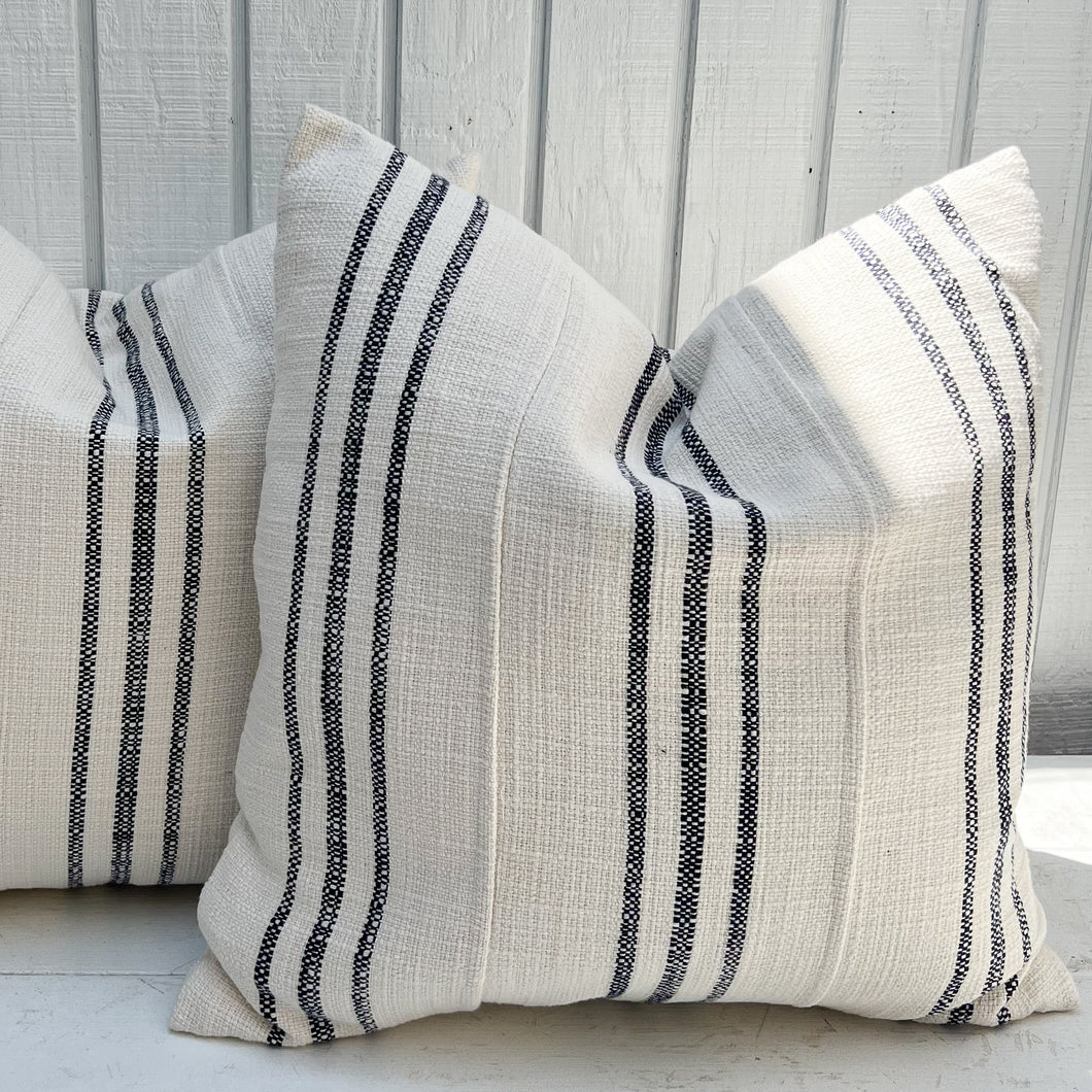 off white grain sack fabric pillow with navy vertical stripes