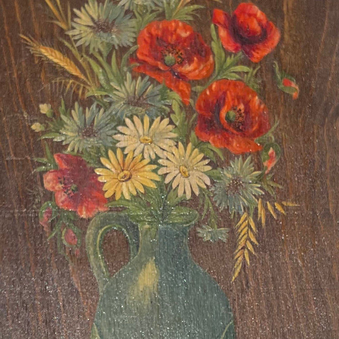still life painting on brown wood of soft yellow daisies, poppies and soft blue flowers in a blue green vase