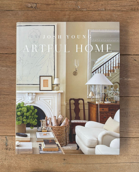 Book cover of 'Artful Home' by Josh Young on a wooden surface