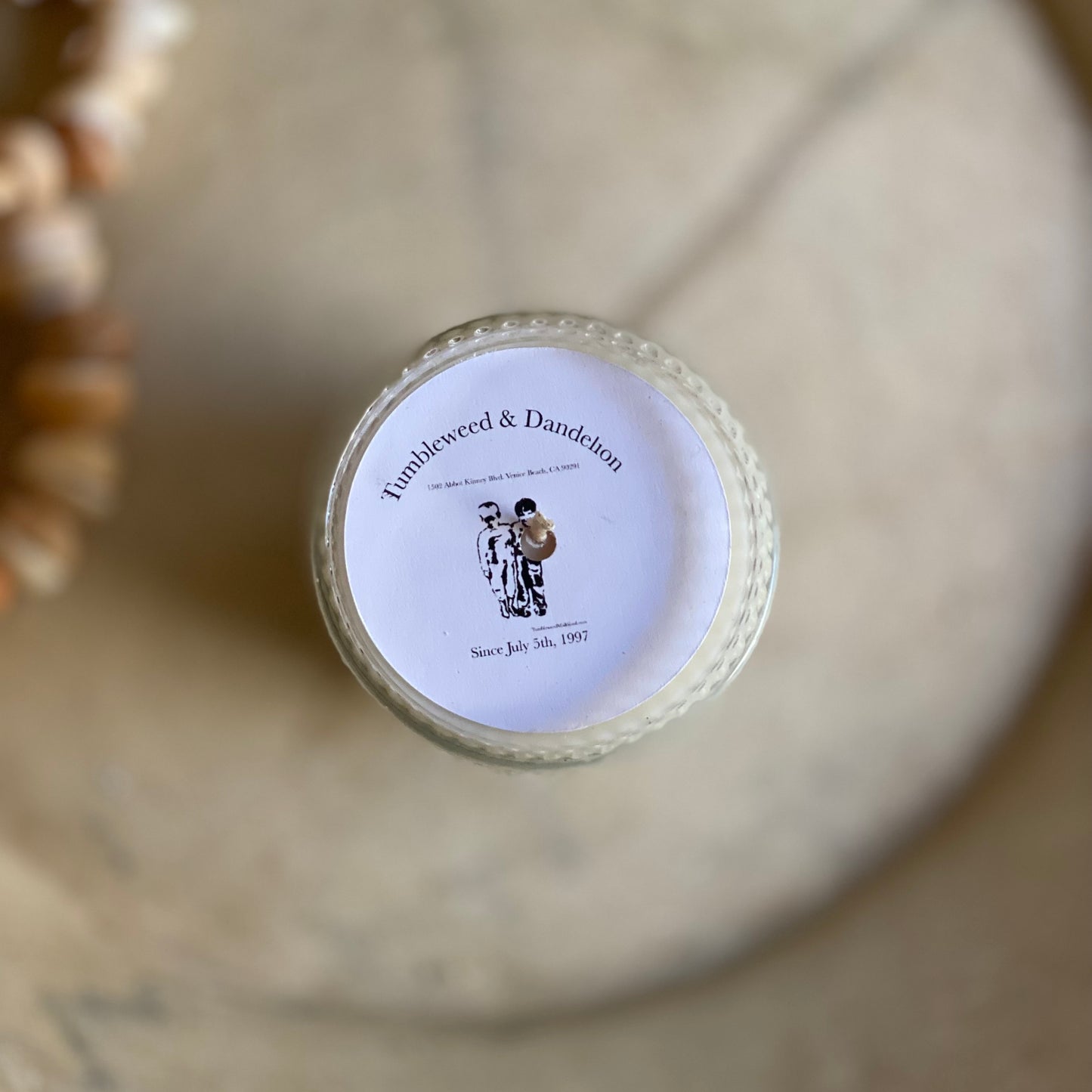 embossed clear glass jar with candle