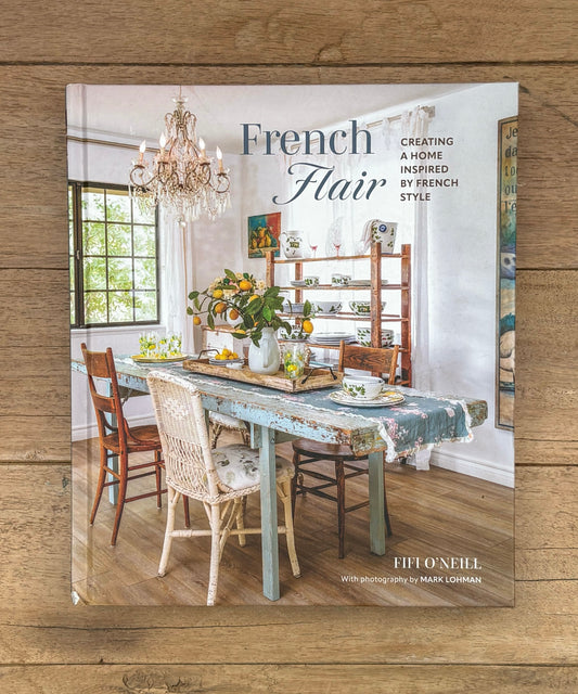 Book titled 'French Flair' on a wooden surface