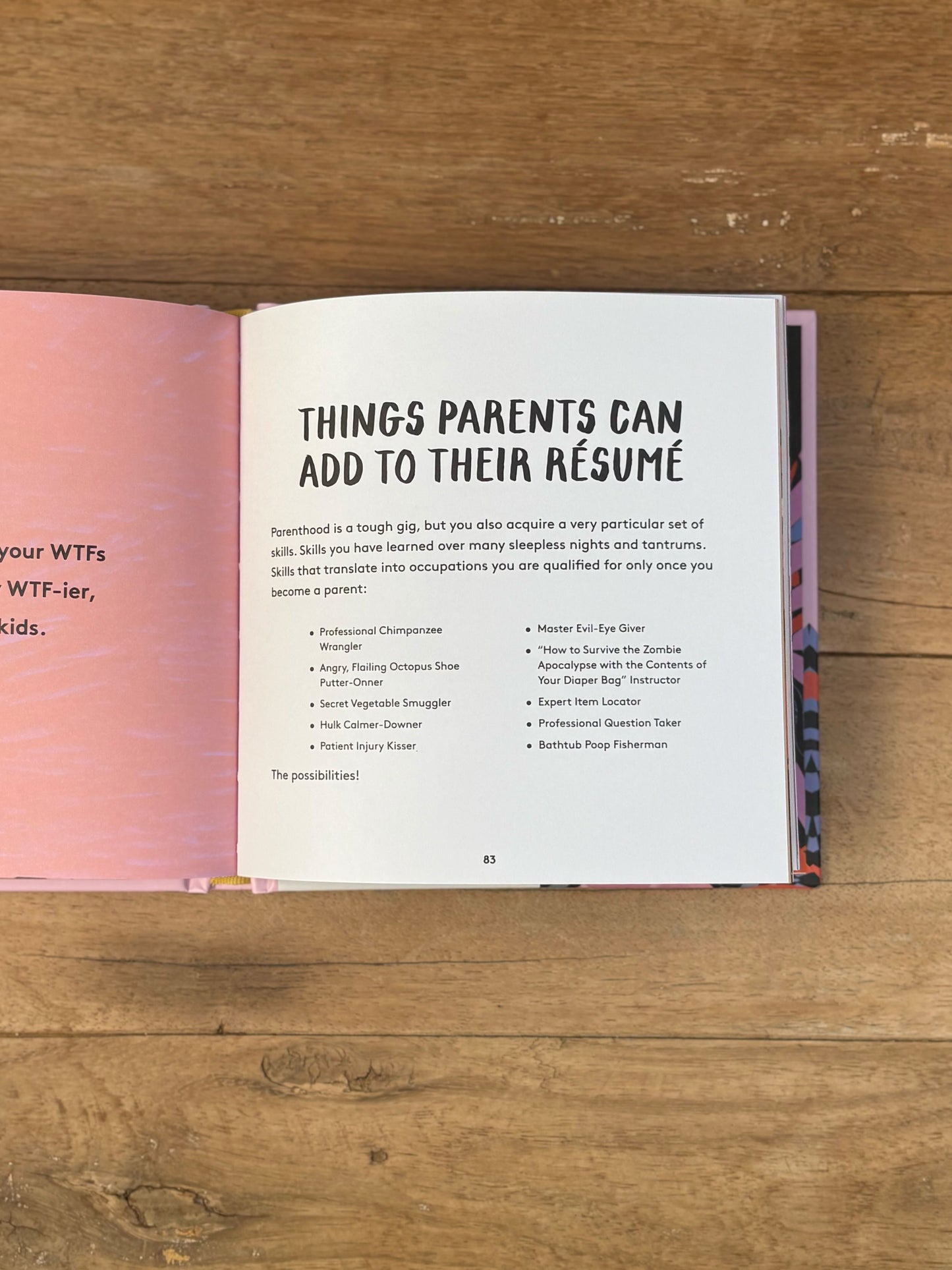 Open book on a wooden surface with text about things parents can add to their resume.