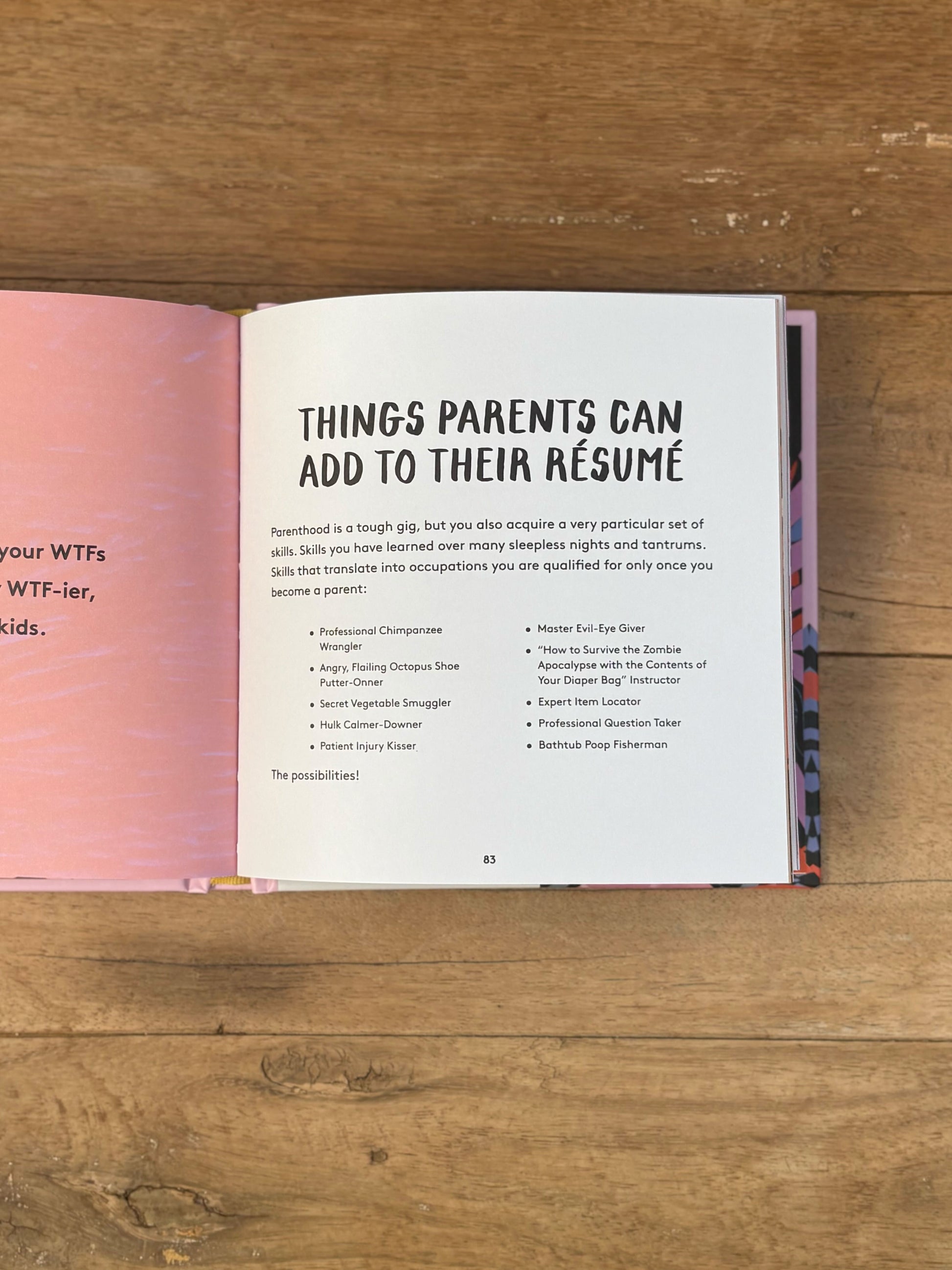 Open book on a wooden surface with text about things parents can add to their resume.