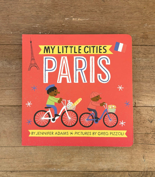 Book cover of 'My Little Cities: Paris' on a wooden surface