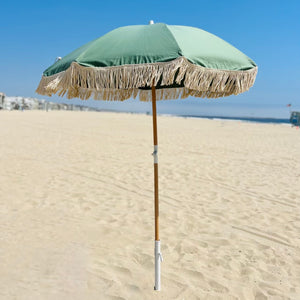 green beach umbrella with fringe