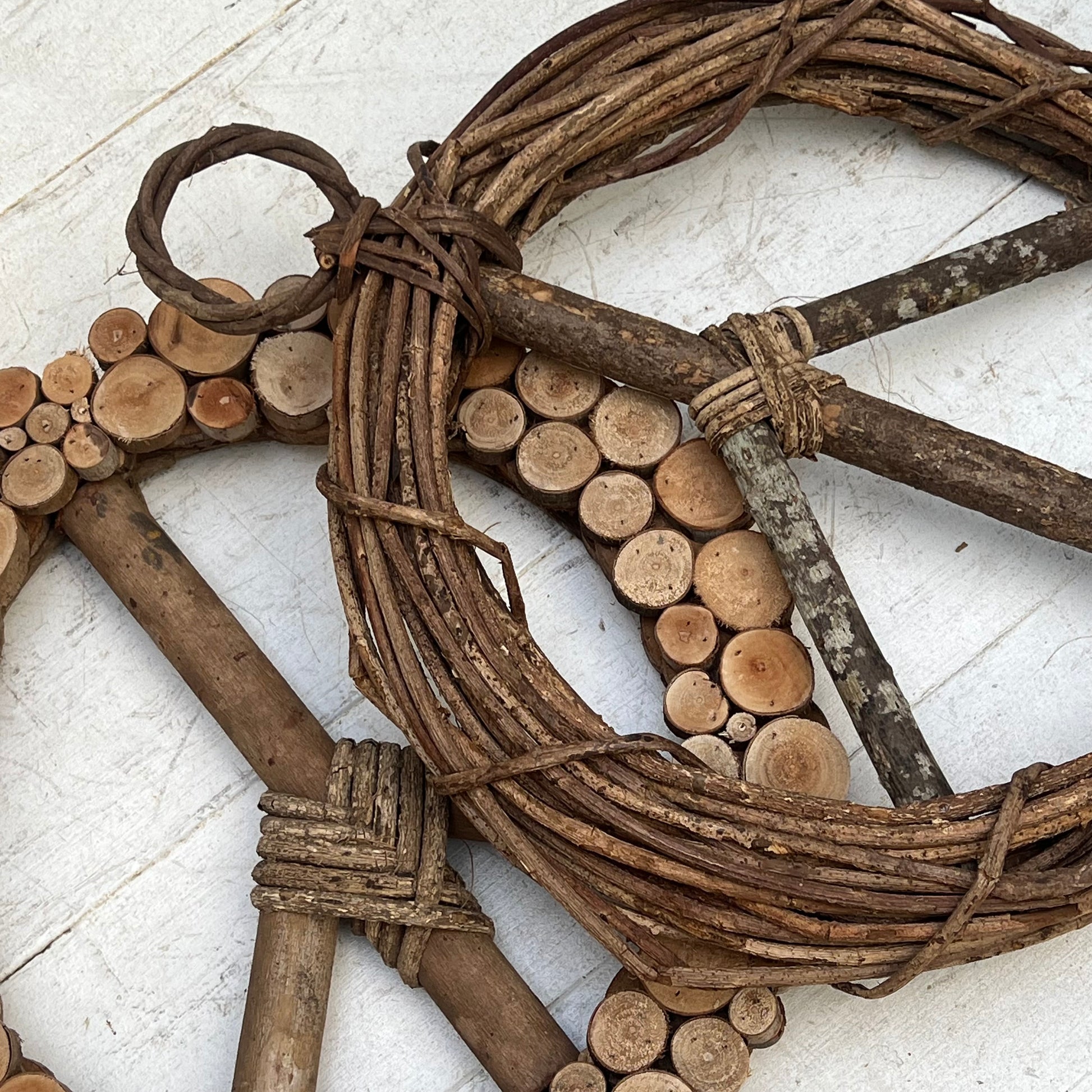 brown vine twig wreath in shape of a peace sign
