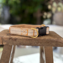 Load image into Gallery viewer, Dog collar with a woven design on a wooden stool outdoors
