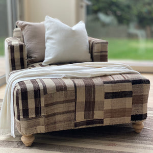 custom made chaise with plaid patchwork fabric in browns and tans, sides of the chaise are natural color