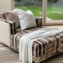 Load image into Gallery viewer, custom made chaise with plaid patchwork fabric in browns and tans, sides of the chaise are natural color