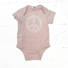 Load image into Gallery viewer, light pink onesie with white floral peace sign