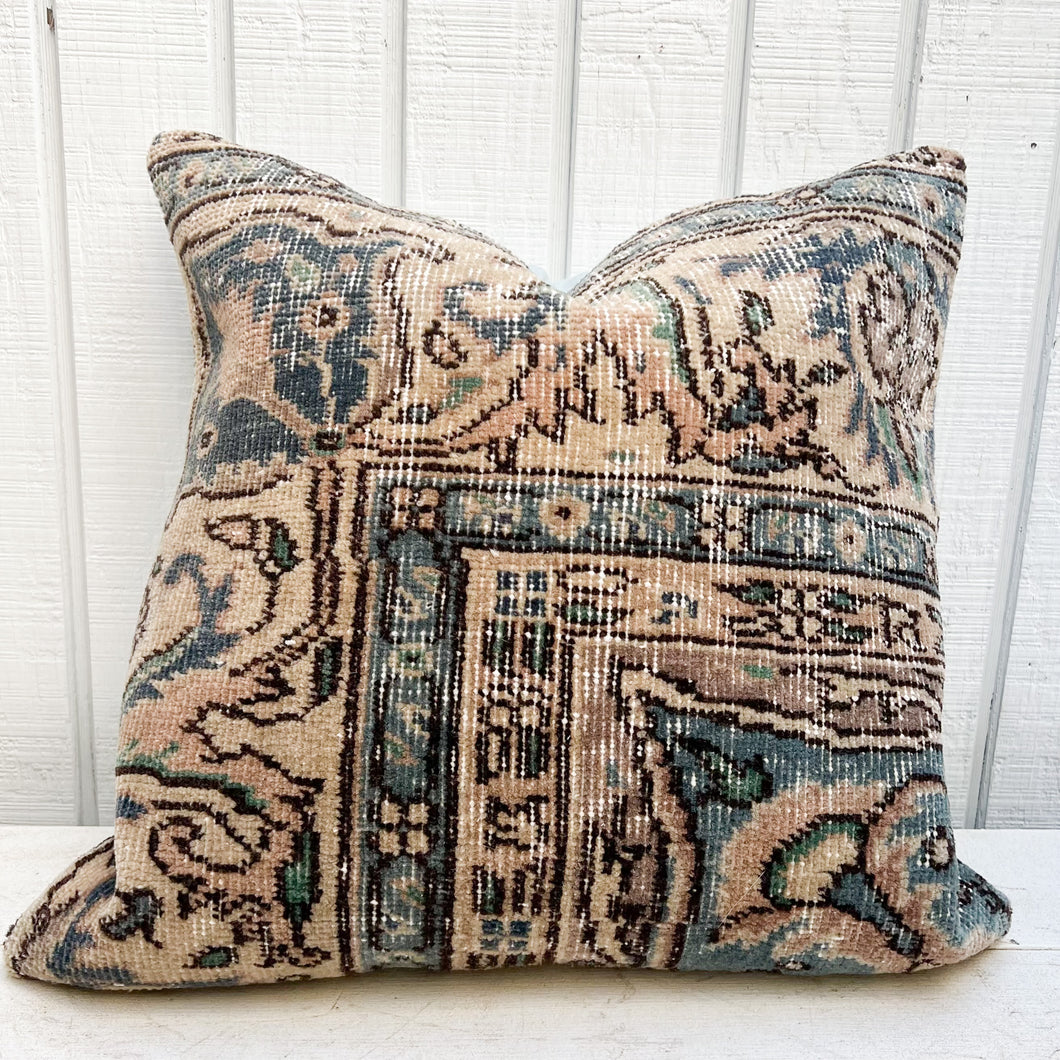 Turkish rug pillow with teal, pale pink and cream colors