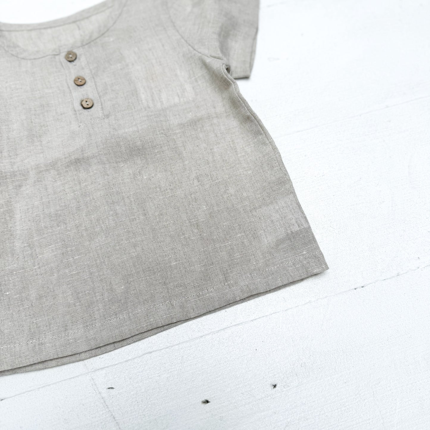 natural colored kid's linen shirt with three buttons