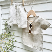 Load image into Gallery viewer, kid&#39;s linen shorts with tan and white pin stripes and three decorative  buttons in front