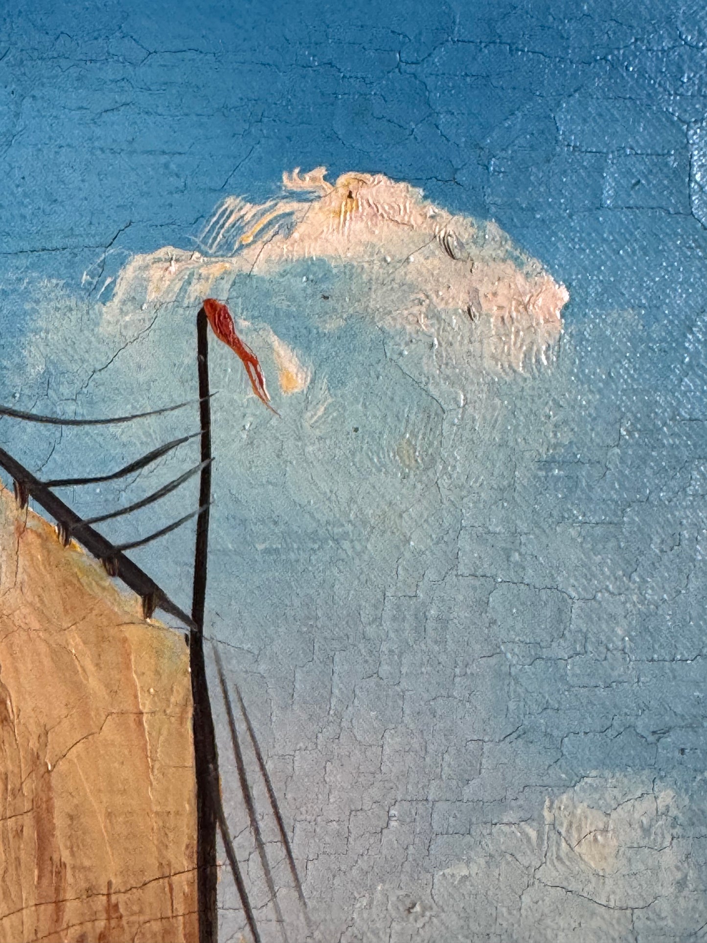 close up of painting of sail with a textured blue and beige background