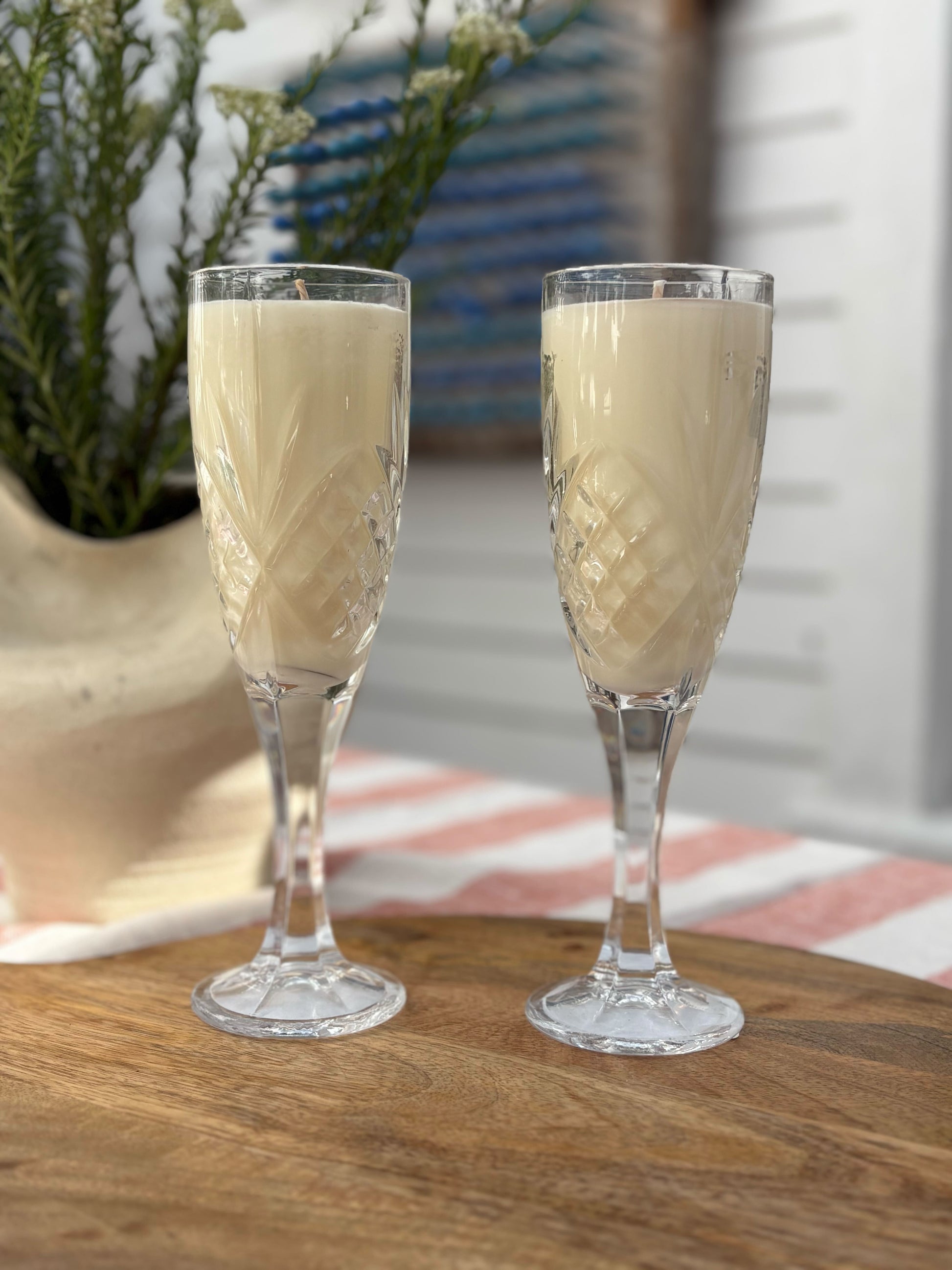 vintage glasses with cream colored candles