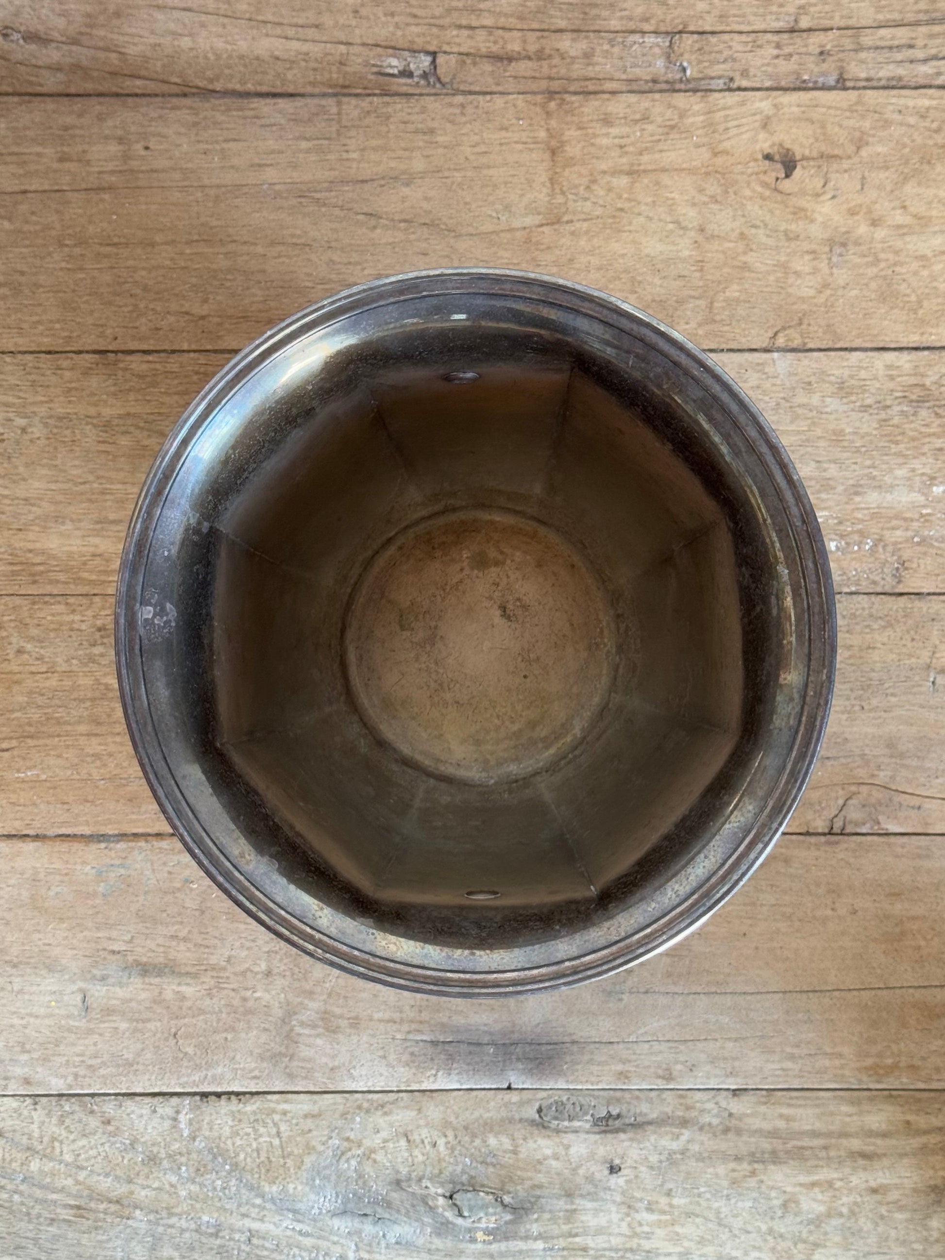 Metal bowl on a wooden surface