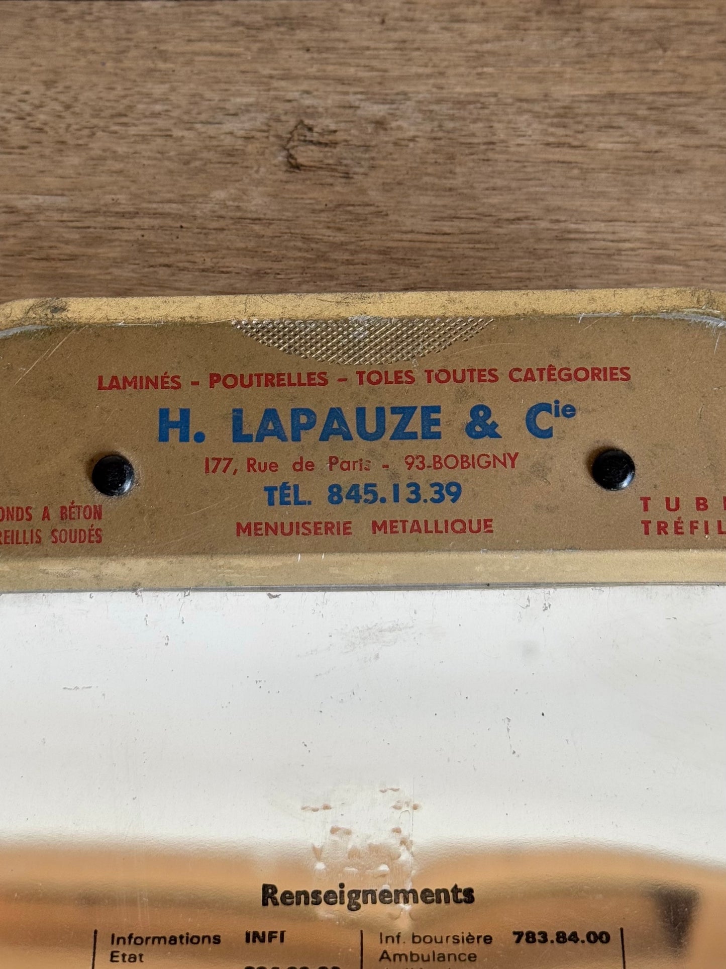 close up of vintage metal clipboard with text on top