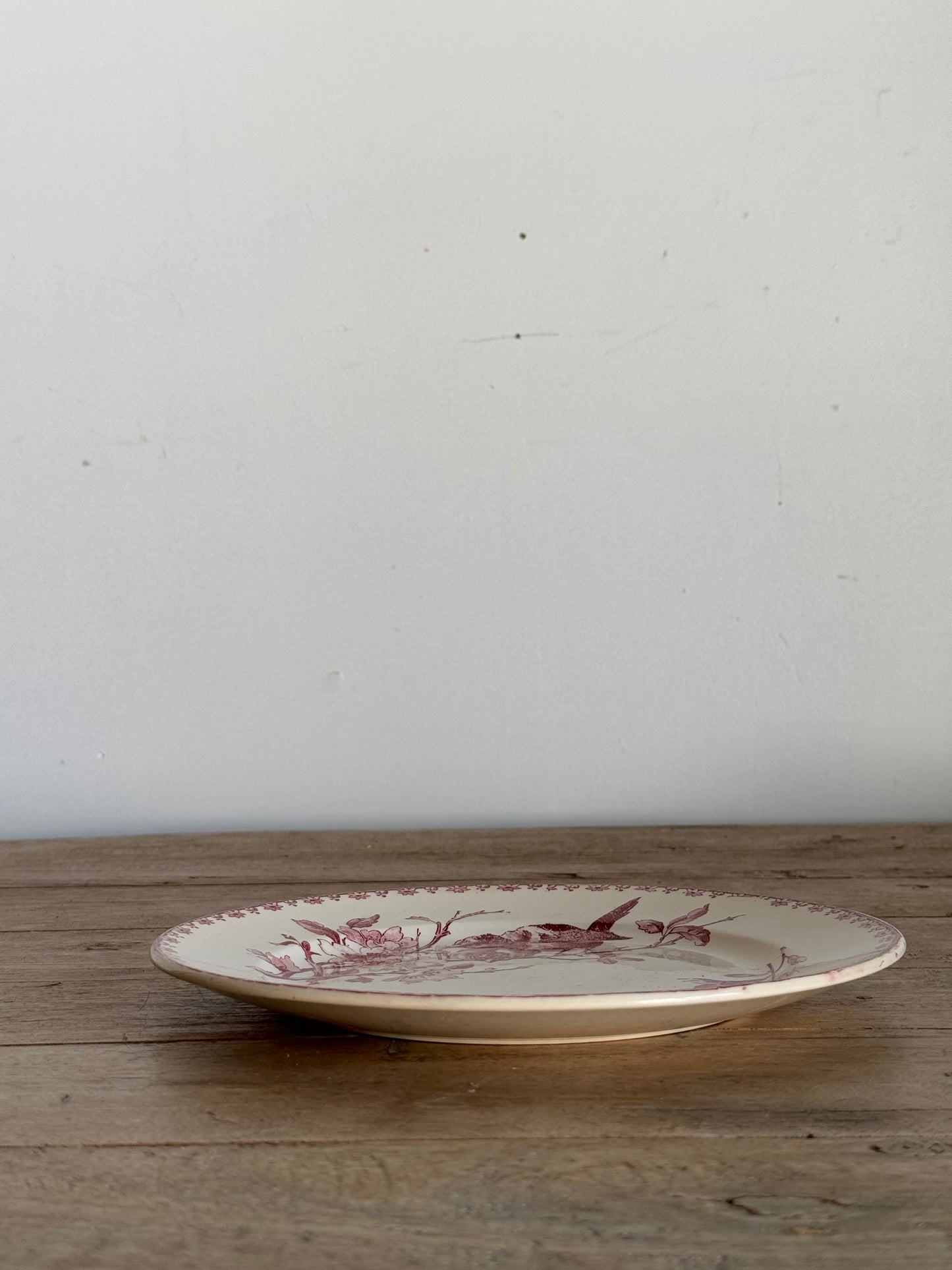 Decorative plate with a design on a wooden surface