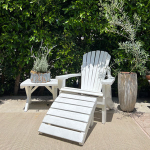 white painted Adirondack chair with ottoman and side table