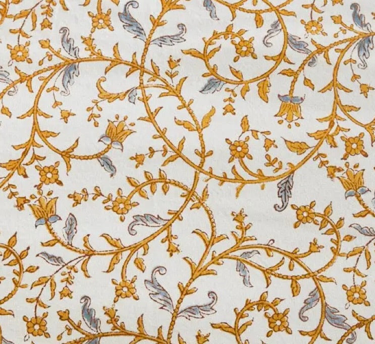 white cotton napkin with amber and gray vine pattern