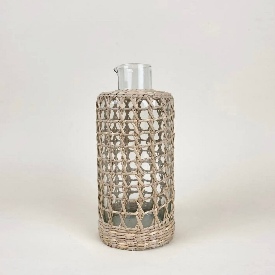 Glassware encased in seagrass