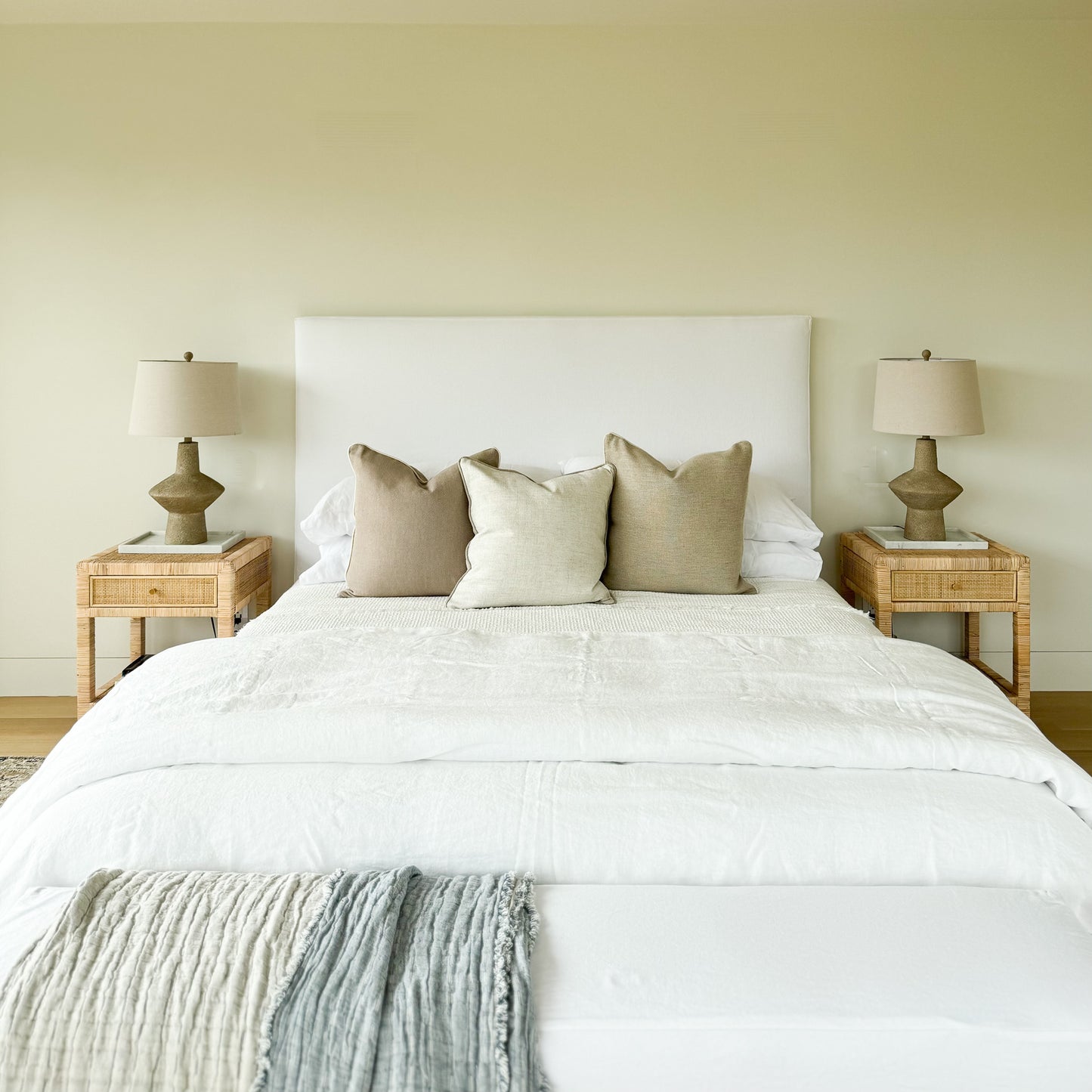 Upholstered bed with white fabric