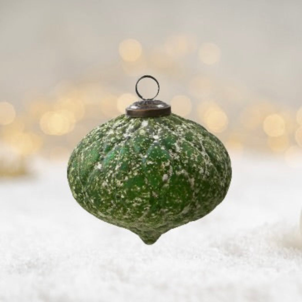 Green textured ornament with a metal cap on a white background