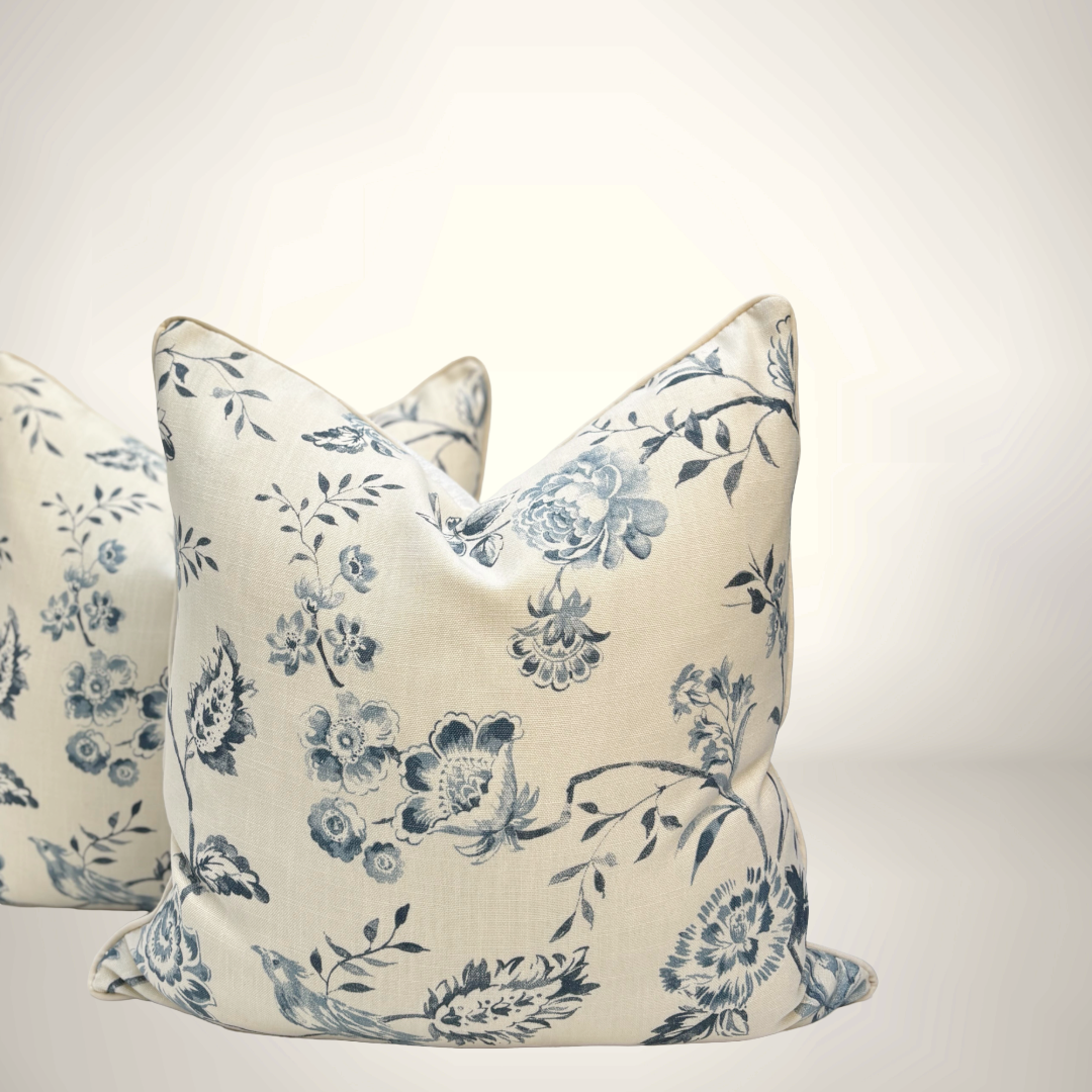 Floral patterned pillows on a white background