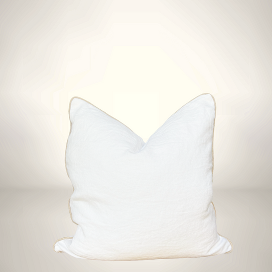 White cat-shaped pillow on a light beige background